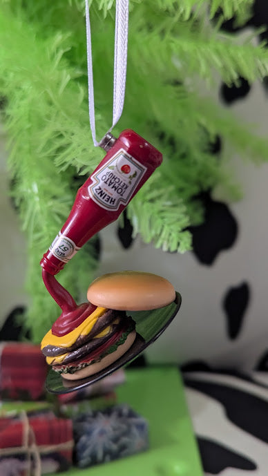 A Miniature Holiday Ornament Burger with Ketchup